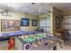 Entertaining game room featuring foosball table and ping pong table at 8571 La Isla Dr, Kissimmee, FL 34747