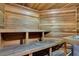 A rustic sauna with wood paneling and comfortable benches for relaxation at 8571 La Isla Dr, Kissimmee, FL 34747
