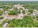 Aerial view of neighborhood, featuring lush green trees and well maintained homes at 918 Louise Ln, Deland, FL 32720