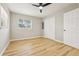 Bright bedroom featuring wood-look flooring, a ceiling fan, and closet at 918 Louise Ln, Deland, FL 32720