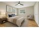 Nicely staged bedroom with hardwood floors, ceiling fan, and stylish furniture at 918 Louise Ln, Deland, FL 32720