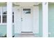 A close up of the front door with decorative glass and smart lock at 918 Louise Ln, Deland, FL 32720