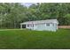 Charming single-story home with manicured lawn and American flag at 918 Louise Ln, Deland, FL 32720
