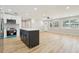 Spacious kitchen featuring stainless steel appliances, a kitchen island, and hardwood floors at 918 Louise Ln, Deland, FL 32720