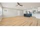 Open concept living and kitchen space showcasing hardwood floors and lots of natural light at 918 Louise Ln, Deland, FL 32720