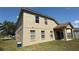 Side view of the house with a lawn perfect for outdoor relaxation and activities at 979 Hacienda Cir, Kissimmee, FL 34741