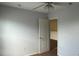 Bedroom with neutral carpeting and blue painted walls, including an open door at 979 Hacienda Cir, Kissimmee, FL 34741
