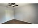 Neutral bedroom features a ceiling fan and closet at 979 Hacienda Cir, Kissimmee, FL 34741