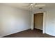Bedroom with tan carpet, light blue paint, a closet and ceiling fan at 979 Hacienda Cir, Kissimmee, FL 34741