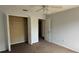 This bedroom features a ceiling fan, closet, and neutral paint at 979 Hacienda Cir, Kissimmee, FL 34741