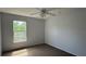 Inviting bedroom with soft natural light, neutral walls and plush carpet, creating a serene and relaxing atmosphere at 979 Hacienda Cir, Kissimmee, FL 34741