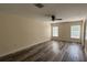 Bright bedroom featuring wood-look flooring, neutral paint, and a ceiling fan at 979 Hacienda Cir, Kissimmee, FL 34741