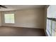 A carpeted bedroom featuring natural light from two windows at 979 Hacienda Cir, Kissimmee, FL 34741