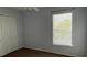 Bedroom featuring a window offering natural light and closet for storage at 979 Hacienda Cir, Kissimmee, FL 34741