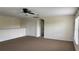 Versatile bonus room features neutral walls, ample closet space, and plush carpeting, ideal for customization at 979 Hacienda Cir, Kissimmee, FL 34741