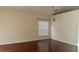 Dining room with hardwood floors, soft neutral walls, a window, and a modern chandelier at 979 Hacienda Cir, Kissimmee, FL 34741