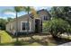Lush landscaped home exterior offering curb appeal with a well maintained lawn at 979 Hacienda Cir, Kissimmee, FL 34741