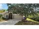 Charming two-story home featuring a well-manicured lawn and a two-car garage at 979 Hacienda Cir, Kissimmee, FL 34741