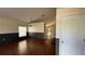 Inviting living room with hardwood floors and neutral two-tone wall paint, complemented by a modern light fixture at 979 Hacienda Cir, Kissimmee, FL 34741