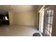Open-concept living room boasts tile flooring and natural light at 979 Hacienda Cir, Kissimmee, FL 34741