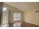 Room with wood floors, natural light, large window, and entry door at 979 Hacienda Cir, Kissimmee, FL 34741