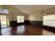 Bright living room featuring hardwood floors, fresh paint, large windows, and neutral color schemes at 979 Hacienda Cir, Kissimmee, FL 34741