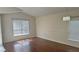 Bright room with wood flooring, blinds, overhead lighting, and white trim at 979 Hacienda Cir, Kissimmee, FL 34741