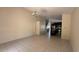 Tiled living area offers seamless flow to an open kitchen with island and modern appliances at 979 Hacienda Cir, Kissimmee, FL 34741