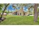 Well-manicured backyard with lush lawn and mature trees at 101 Majestic Forest Run, Sanford, FL 32771