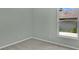 Empty bedroom features carpet flooring and a window with a view of the yard at 101 Majestic Forest Run, Sanford, FL 32771