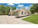 Side view of a home with a spacious driveway and attached garage at 101 Majestic Forest Run, Sanford, FL 32771