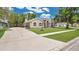 Attractive house showcasing a lengthy driveway and well-maintained front yard at 101 Majestic Forest Run, Sanford, FL 32771