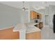 Kitchen with a breakfast bar and a view into the spacious living room at 101 Majestic Forest Run, Sanford, FL 32771