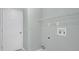 This laundry room features a white door and wire shelving at 101 Majestic Forest Run, Sanford, FL 32771