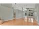 Spacious living room boasting hardwood floors, high ceilings, and a view into the kitchen at 101 Majestic Forest Run, Sanford, FL 32771