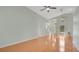 Inviting living room with vaulted ceilings, hardwood floors, and plenty of natural light at 101 Majestic Forest Run, Sanford, FL 32771