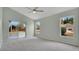 Main bedroom features carpet floors, ceiling fan and a sliding glass door leading to a patio at 101 Majestic Forest Run, Sanford, FL 32771