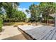 Backyard deck with minimalist landscaping, patio furniture, and lots of mature trees for privacy and shade at 1012 N Shine Ave, Orlando, FL 32803