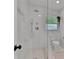 Modern bathroom features glass-enclosed shower, rainfall shower head, and sleek fixtures at 1012 N Shine Ave, Orlando, FL 32803