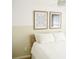 Bedroom with a wooden bedframe, minimalist wall art, and a ceiling fan at 1012 N Shine Ave, Orlando, FL 32803