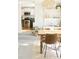 Dining room with a modern light fixture, dining table, and view into the kitchen at 1012 N Shine Ave, Orlando, FL 32803