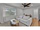 Cozy living room featuring a light colored sofa, decorative lemons, and a large window at 1012 N Shine Ave, Orlando, FL 32803