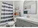 This is a well-lit bathroom featuring a modern sink, a new toilet, and decorative artwork at 102 Royalty Cir, Sanford, FL 32771