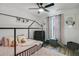 This is a bedroom featuring butterfly wall art, a play structure, and a metal framed bed at 102 Royalty Cir, Sanford, FL 32771