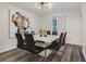 Bright dining room featuring modern lighting and seating for eight at 102 Royalty Cir, Sanford, FL 32771