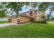 Charming two-story home with a well-manicured lawn and two car garage at 102 Royalty Cir, Sanford, FL 32771