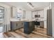 Open kitchen featuring gray cabinets, stainless appliances, and wood flooring at 102 Royalty Cir, Sanford, FL 32771