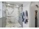 The main bathroom has a walk-in shower featuring marble tiling, glass door, and modern fixtures at 102 Royalty Cir, Sanford, FL 32771