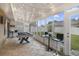 Sun room showcasing a pool table, bar stools, tile floors, string lights and large windows at 102 Royalty Cir, Sanford, FL 32771