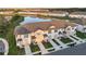 Townhomes overlooking a beautiful lake, providing a serene community atmosphere at 1067 Plantation Ln, Davenport, FL 33896